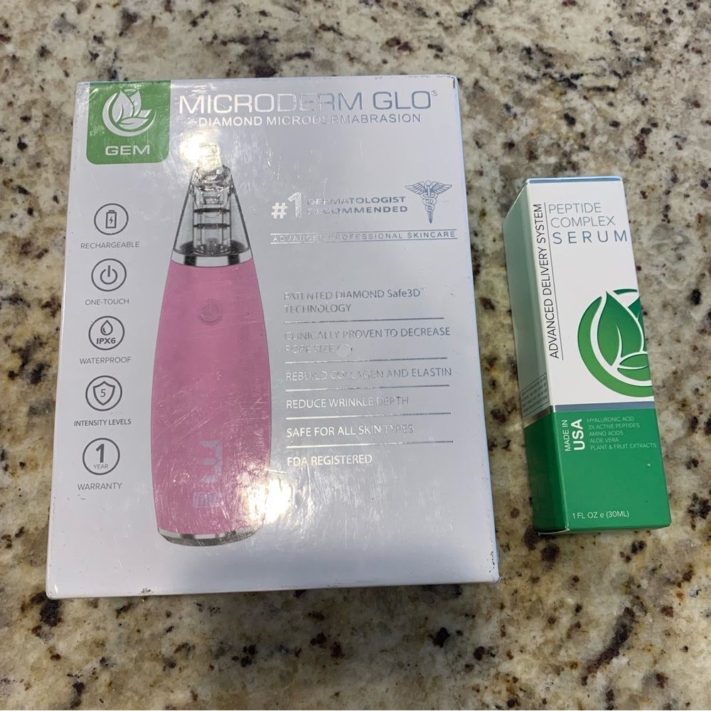 Microderm Glo Diamond Microdermabrasion and Suction Tool Pink and Peptide Serum